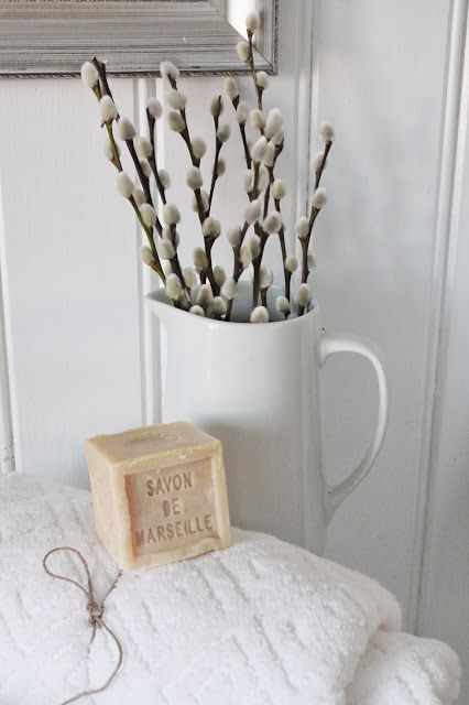 a white jug with willow is a simpel and natural decoration for any space - from a bathroom to a bedroom