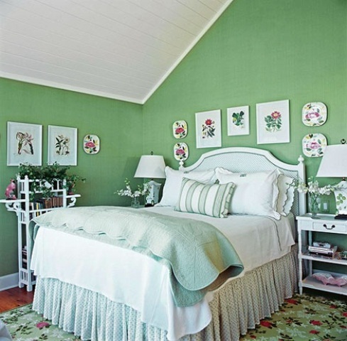 Floral and botanical print plates and bright bedding and potted blooms make the space feel spring inspired