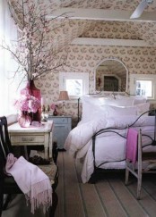 floral wallpaper, pink bedding and blooming branches refresh the bedroom for spring