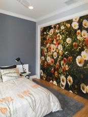 a floral statement wall and botanical bedding for a spring feel in the bedroom and a fresh touch