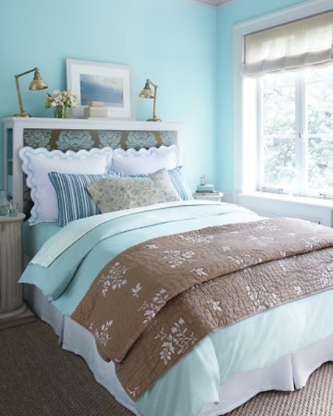 bright and fresh blues in the ddecor echo int he bedding, too, and make the bedroom look fresh
