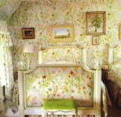 an all-floral bedroom with bright wallpaper and a matching bed is a unique space that all feels like spring