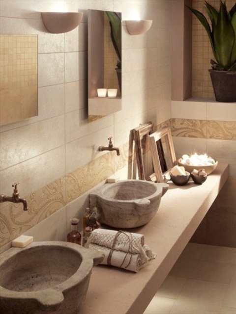 Stone bowl like sinks are amazing to add a natural touch to the space and they look very chic